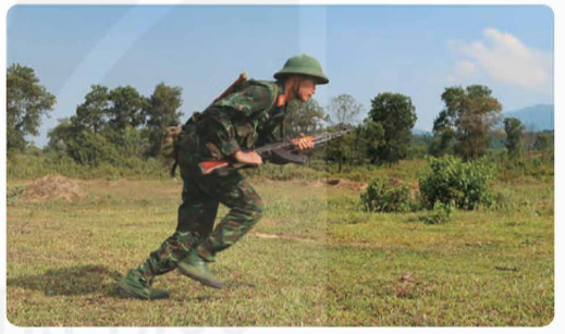 A person in military uniform holding an object

Description automatically generated